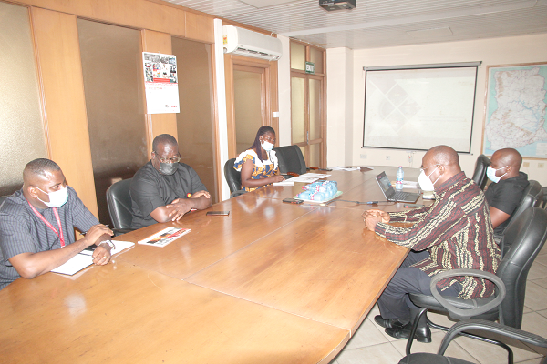 Mr Michael Ansah (right), the Chief Executive Officer of Ghana Integrated Aluminium Development Corporation (GIADEC), speaking at the meeting. On the table are Mr Franklin Sowa (left), Director of Marketing and Sales, Mr Theophilus Yartey (2nd left), Deputy Editor of the Daily Graphic, Mrs Gertrude Ankah Nyavi (3rd left), reporter with the Daily Graphic and Mr Kojo Yankah (2nd right), Head of Communication at GIADEC.