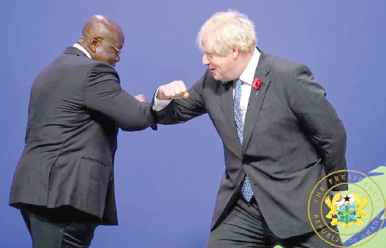 President  Akufo-Addo (left) exchanging pleasantries with the British Prime Minister, Boris Johnson, at the World Leader’s Summit in Glasgow