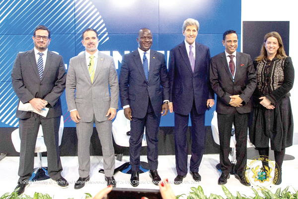 Mr Abu Jinapor (3rd from left), Minister of Lands and Natural Resources, with Mr John Kerry (3rd from right), former Secretary of State and US Special Presidential Envoy for Climate Change, and other  dignitaries