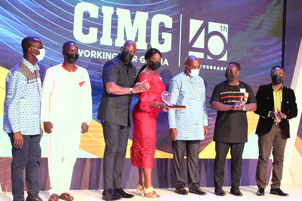  Mr Ato Afful (3rd from left), MD of the Graphic Communications Group Ltd., applauding after his team had received the Media Organisation of the Year award last Saturday. Picture: MAXWELL OCLOO 