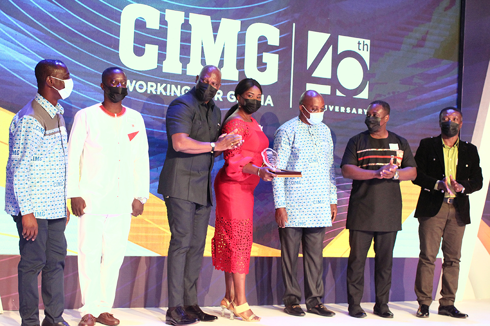  Mr Ato Afful (3rd from left), MD of the Graphic Communications Group Ltd., applauding after his team had received the Media Organisation of the Year award last Saturday. Picture: MAXWELL OCLOO 