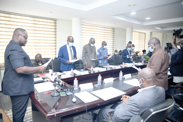 Mr Francis Asenso-Boakye (left), Minister of Works and Housing, inaugurating the board