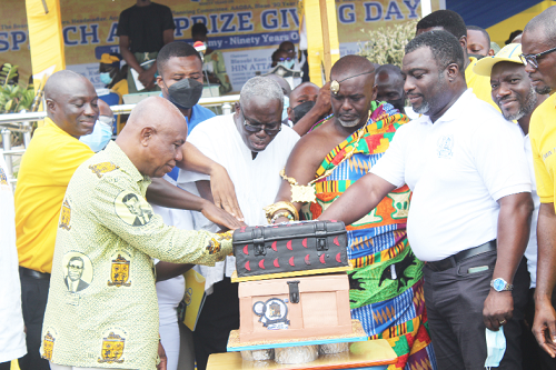Mr Emmanuel Ofoe Fiemawhle (middle), Headmaster of Accra Academy, being assisted by some past students to cut the 90th anniversary cake. Picture: Patrick Dickson 