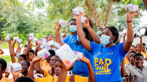 Members of the Rotary and Rotaract clubs and the learners displaying the sanitary pads after the donation exercise
