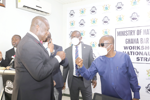 Mr Albert Kan-Dapaah (right),  Minister of National Security, exchanging pleasantries with Mr Anthony Forson Jnr (left), a former President of the Ghana Bar Association after the workshop in Accra. Looking on is Mr Yaw Acheampong Boafo (2nd right), the President of the Ghana Bar Association. Picture: GABRIEL AHIABOR