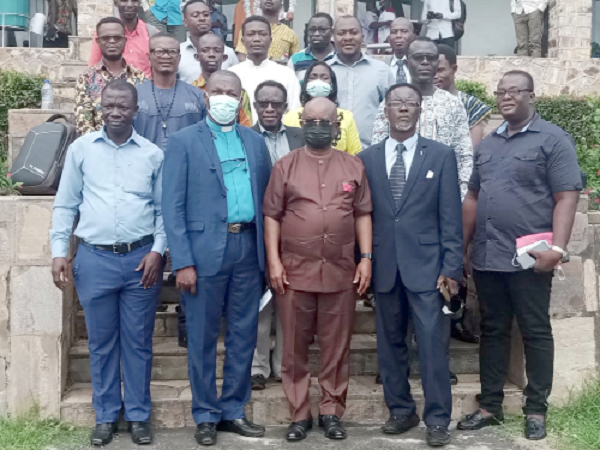 Dr Letsa (middle in front row) with some clergymen and journalists after the briefing. With him is Rev. Seth K. Mawutor, Chairman of the Planning Committee (2nd from left)