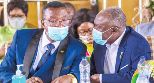  Mr Patrick Owusu (right), Board Chairman, conferring with Dr Stephen Sarfo Kantanka, CEO of the bank, during the meeting 