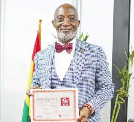 Mr Yofi Grant with the certificate recognising the GIPC as number 1
