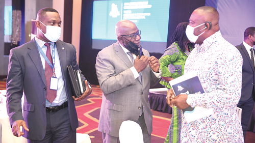 Mr Stephen Asamoah-Boateng (right), Director-General, State Interest and Governance Authority, interacting with Mr Felix Addo (middle), President of the Ghana Association of Restructuring and Insolvency Advisers, and Dr Eric Oduro Osae, Director-General, Internal Audit Agency, during the workshop. Picture: EMMANUEL QUAYE