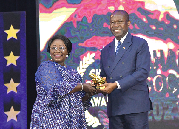Mrs Akosua Frema  Osei-Opare (left), Chief of Staff, presenting the Lifetime Achievement Award to Mr Joseph Boahen Aidoo, Chief Executive of Ghana Cocoa Board. Picture: EBOW HANSON