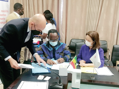 Flashback: Mr Benjamin Gyasi (middle), Chief Director of the Ministry of Education, signing the agreement for Ghana, while other dignitaries look on