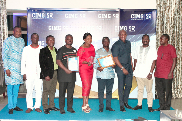 Mr Ato Afful (3rd from left), MD of the Graphic Communications Group Ltd., in a pose with his team after they received the Media Organisation of the Year award