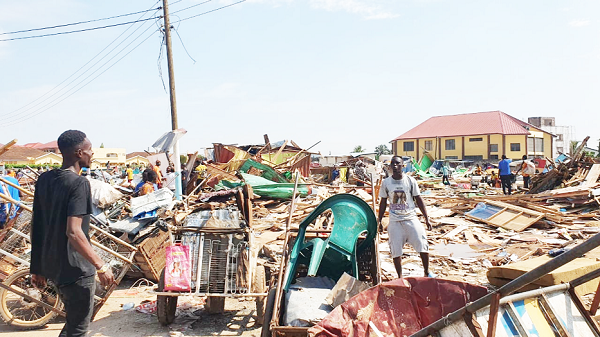 Some victims trying to salvage some property from the debris after the demolition. Picture: DELLA RUSSEL OCLOO