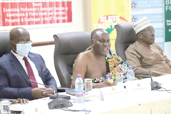 Nana Otuo Siriboe, speaking at the forum. With him are Mr Alban Bagbin (right), Speaker of Parliament, and Mr Osei Kyei Mensah-Bonsu (left), Majority Leader. Picture: EMMANUEL BAAH