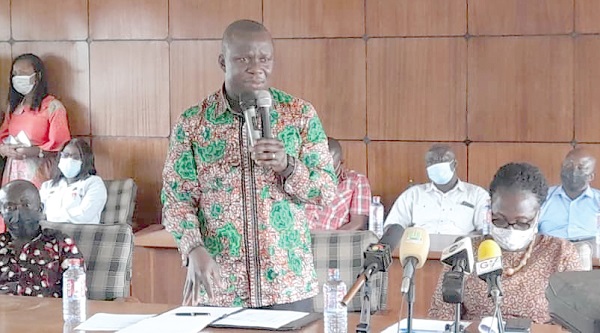 Mr Samuel Abu Jinapor (with mic), Minister of Lands and Natural Resources, addressing members of the Bono Regional House of Chiefs