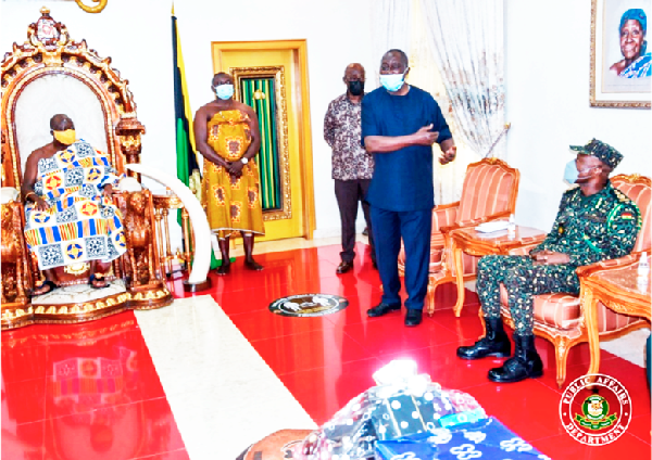 Dr Edward Prempeh (second right), Chairman of the Governing Council of the Immigration Service, introducing the GIS delegation to the Asantehene