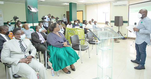 Mr. Kobena Addison (right), MD, QIC, addressing the audience at the event