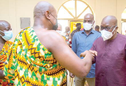 Togbe Afede (back to camera) exchanging pleasantries with Mr. Bagbin