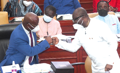 Mr. Osei Kyei-Mensah-Bonsu, Majority Leader, in a fist bump with Mr. Ken Ofori Atta, Finance Minister, after the reading of the 2022 Budget