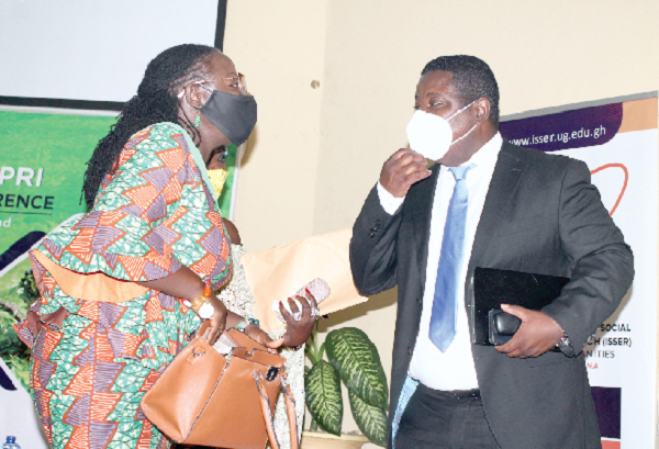 Prof. Nana Aba Appiah Amfo (left), Vice-Chancellor, University of Ghana, in a discussion with  Prof. Peter Quartey (right), Director, Institute of Statistical, Social and Economic Research. Picture: Maxwell Ocloo