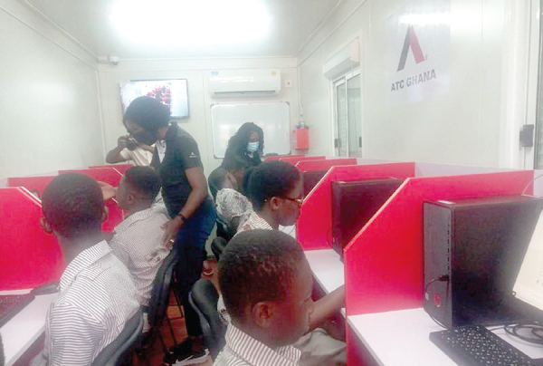 Some pupils of Jamdede Adom Primary School try their hands on the computer after the opening of the ICT centre