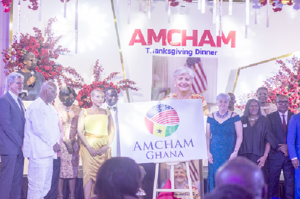Ms Stephanie Sullivan (3rd from right), United States Ambassador to Ghana, with Mrs Ayesha Bedwei Ibe (4th from left), President, AMCHAM Ghana, with former presidents of the chamber and current  board members unveiling the new logo of AMCHAM