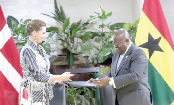 President Akufo-Addo exchanging documents with Mrs Mette Frederiksen (left), the Prime Minister of Denmark. Picture: SAMUEL TEI ADANO 