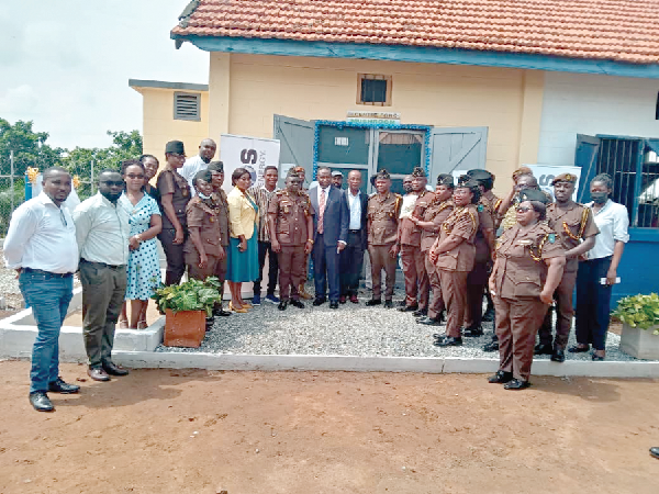 Officials of Kosmos Energy with officers from the James Camp Prison and Senior Correctional Centre after the commissioning of the hunger relief projects