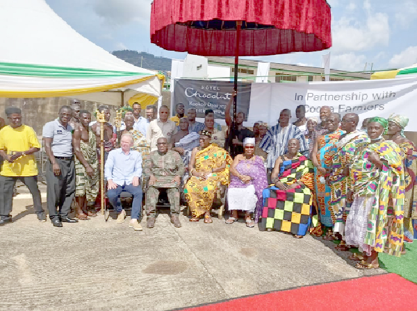 Mr Angus Thirlwell (1st from right seated), Chief Executive Officer of Hotel Chocolat,  Nana Effah Pinamang III (seated in middle), Chief of Obomeng Traditional Area, and some representatives of the partners and farmers during the launch 