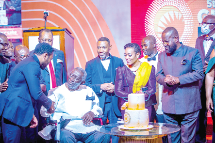 Mr Kimathi Agyeman-Rawlings (left) exchanging pleasantries with former President J. A. Kufuor at the energy awards. Looking on is Dr Zanetor Agyeman-Rawlings (2nd from right)