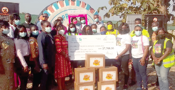 Ms. Susana Ndede (3rd from right), Human Resource Information Systems Officer of AGA, presenting a dummy cheque to some staff of KCCR