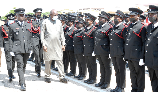 Mr. Ambrose Dery (right), Minister for the Interior, reviewing the parade. Picture: EBOW HANSON