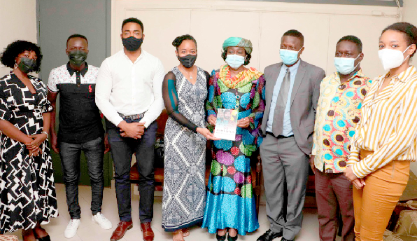 Mrs. Agyeman-Rawlings (4th from right) and Dr. Zanetor Agyeman-Rawlings (4th from left) displaying a copy of the book after the presentation by Dr. Wale Okediran (3rd from right), General Secretary, PAWA
