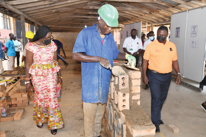  Ms Gifty Twum-Ampofo (left), Deputy Minister of Education in charge of TVET, and Dr Fred Kyei Asamoah (right), Director-General of CTVET, touring the Construction Department of the ATTC. Picture: EBOW HANSON