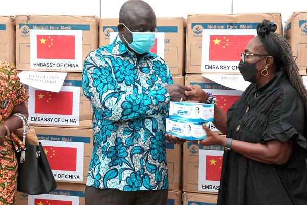 Nii Adjei Tawiah, MCE for Klottey Korley, receiving the nose masks from Mrs Newman, Chief Operations Officer, Office of the First Lady