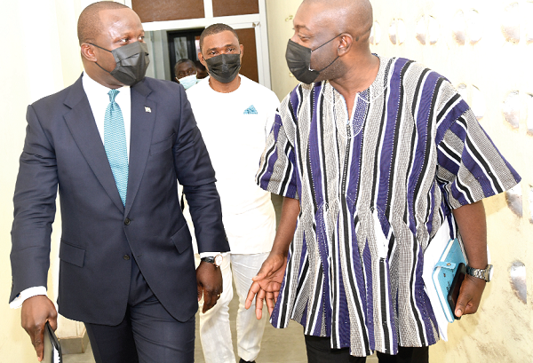  Mr Samuel Abu Jinapor (left), Minister of Lands and Natural Resources, exchanging pleasantries with Mr Kojo Oppong Nkrumah (right), Minister of Information. With them is Mr George Mireku Duker, Deputy Minister, Lands and Natural Resources. Picture: EBOW HANSON