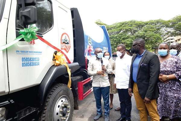 Dr Henry Kwabena Kokofu (left), Executive Director of the Enviromental Protection Agency, after unveiling one of the specialised trucks 