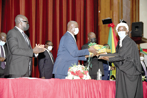  Justice Anim Yeboah (2nd  left), Chief Justice, presenting the overall Best Award to Mr Adomako Samuel Nimako. Looking on are Mr Godfred Yeboah Dame (left), Attorney General and Minister of Justice, and Mr Anthony Forson (2nd from right), GBA President. Picture: EBOW HANSON