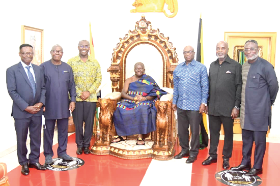 Otumfuo Osei Tutu II with officials of Rocksure International and the Ghana Integrated Aluminium Development Corporation (GIADEC). They are Mr Tony Oteng-Gyasi (3rd from right), Mr Michael Ansah (3rd from left) and Mr Kwasi Ofori (2nd from right).