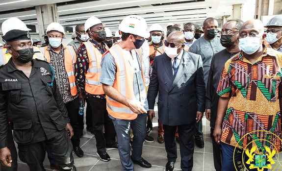 Construction staff briefing President Nana Addo Dankwa Akufo-Addo during his tour of the Kumasi Airport