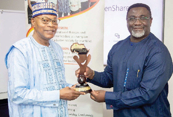 Dr Mohammed Ibn Chambas (left) receiving an award from Mr Andy Osei Okrah, President and Founder of the Young Professionals and Youth Coalition. Picture: ebow hanson
