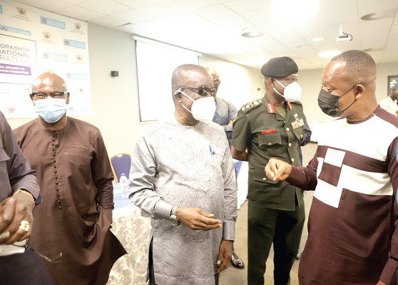  Mr Albert Kan-Dapaah (2nd from left), Minister of National Security, explaining a point to Mr David Agbee (right), Executive Director, Ghana Institute of Governance and Security, after the workshop. Looking on are Mr Ibrahim-Tanko Amidu (left), Executive Director, Star-Ghana Foundation. Picture: EDNA SALVO-KOTEY