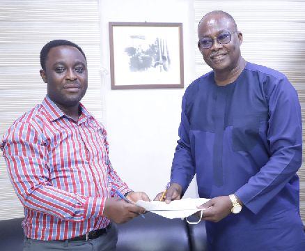 Dr. Ekwow Spio-Garbrah (right), Chairman, African Business Centre for Developing Education and Mr. Kingsley Mate-Kole (left), Acting General Manager, G-Pak Limited, exchanging documents after the signing ceremony. Picture: EDNA SALVO-KOTEY