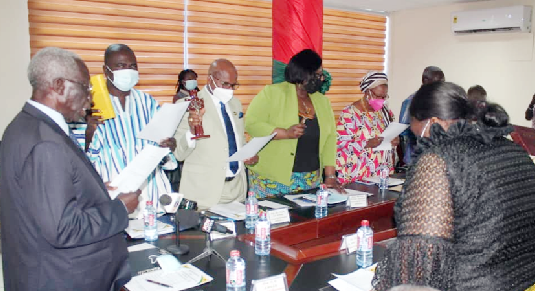 Mr. Yaw Osafo-Maafo (left), Senior Presidential Advisor, swearing in the council members