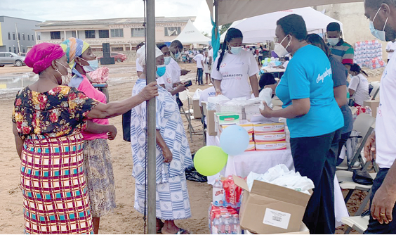 Some members of the community receiving their packs