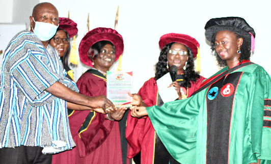Ms. Ibrahim Maridiya Mohammed (right), receiving the Overall Academic Excellence Award from Alhaji Mahama Asei Seini (left), Deputy Minister of Health. Assisting him are Dr. Abigail Agartha Kyei (3rd from left), President, Ghana College of Nurses and Midwives (GCNM), Dr. Jemima Denis-Antwi (2nd right), Founding President, GCNM and Ms. Hannah Oparebea Acquah (2nd left), Rector, GCNM. Picture: Maxwell Ocloo
