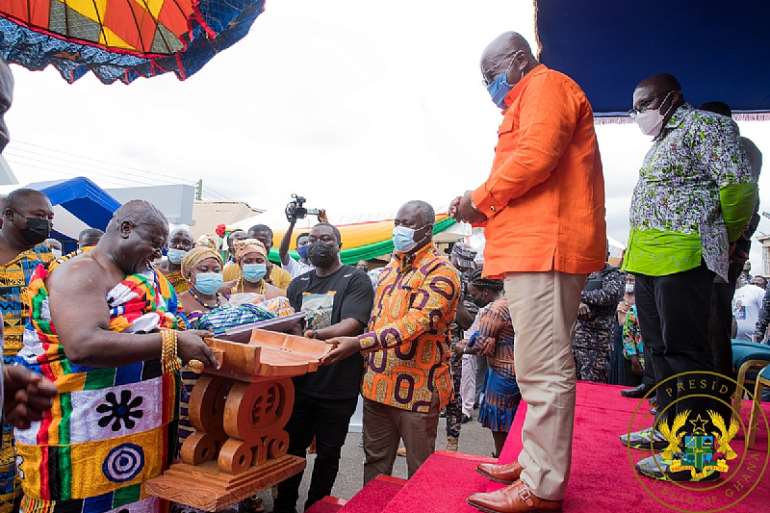 President Akufo-Addo being given a traditional stool as a gift