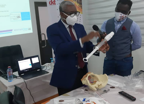 Dr Ali Samba, Director of Medical Affairs  Korle Bu Teaching Hospital, demonstrating the use of the Manual Vacuum Aspirator (MVA)