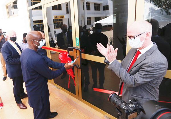  Prof. Mohammed Salifu, Director General, Ghana Tertiary Education Commission, joined by Mr Rakesh Wahi (partly covered), Co-Founder, Lancaster University Ghana, to cut the tape for the official opening of the Sakyi Campus. Picture: NII MARTEY M. BOTCHWAY