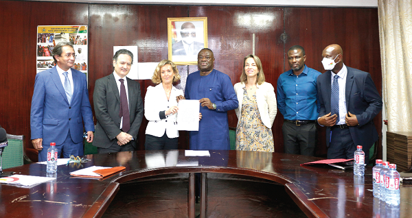 Dr Ibrahim Mohammed Awal (middle), Minister of Tourism, Arts  and Culture, exchanging documents with Ms Mar Casanova Llorens (3rd from left), Director - International Affairs, INCYDE Foundation. With them are some officials of the Spanish Embassy and the Tourism Ministry. Picture: NII MARTEY M. BOTCHWAY